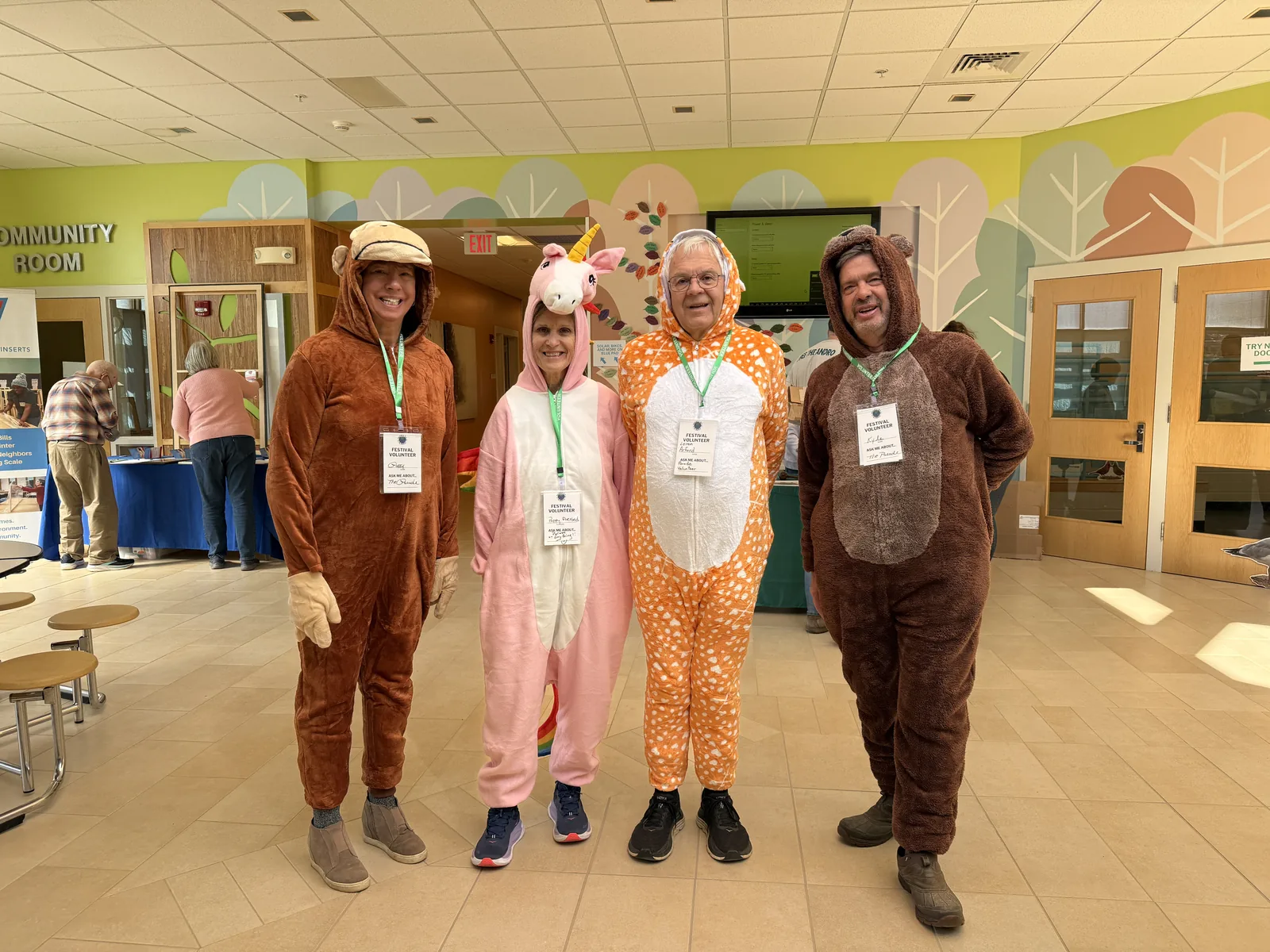 Festival volunteers in animal costumes joining the All Species Parade