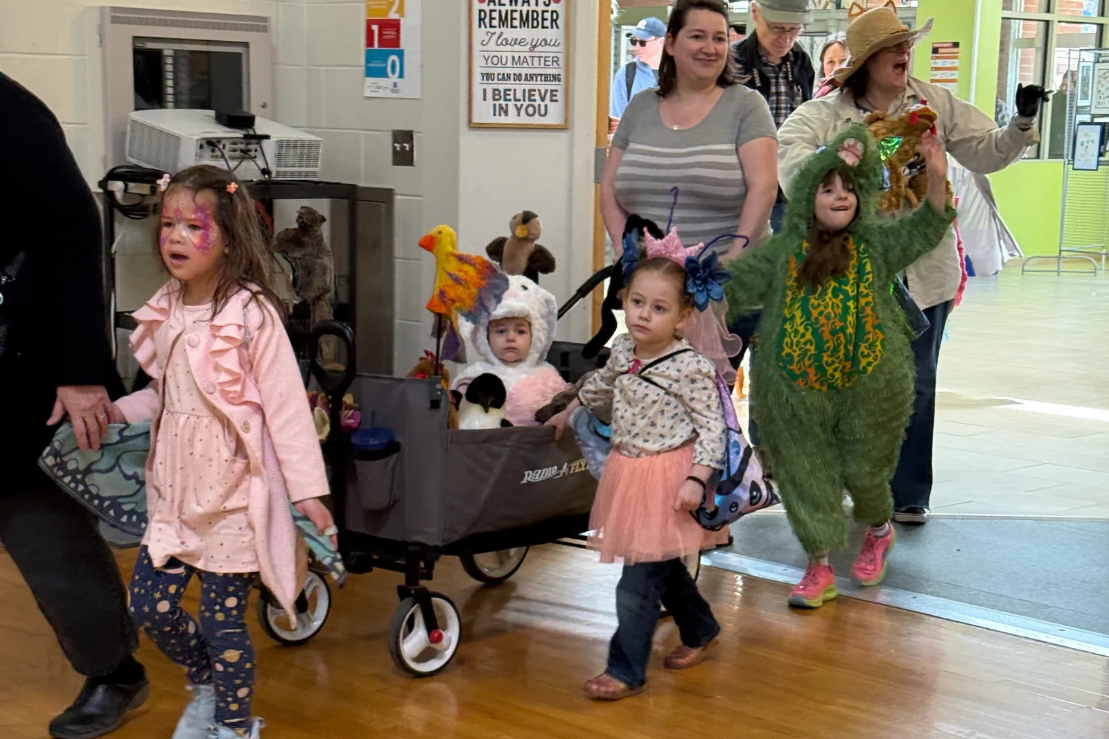 A family in costume walking together in the All Species Parade