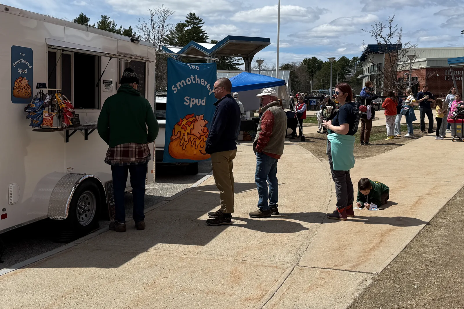 Food trucks serving visitors outside during the 2026 Earth Day Festival in Brunswick