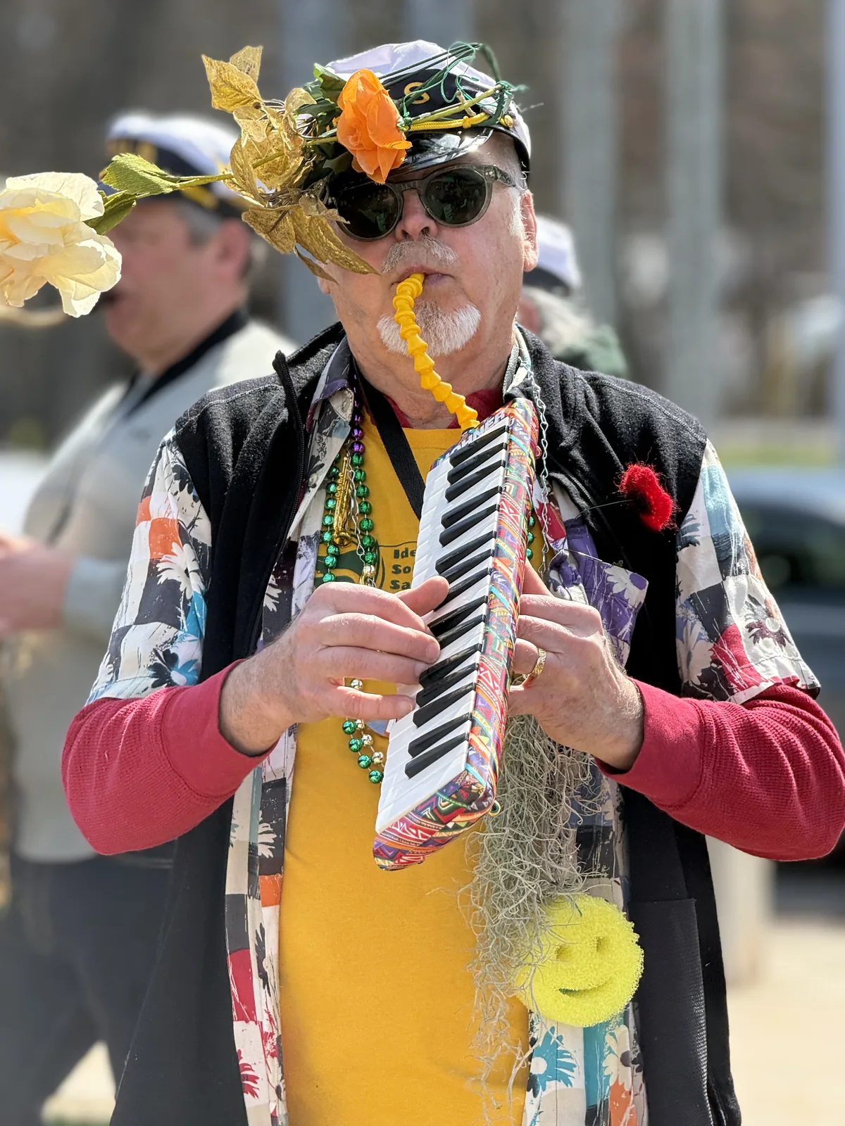 Musician marches in the All Species Parade at the 2026 Earth Day Festival