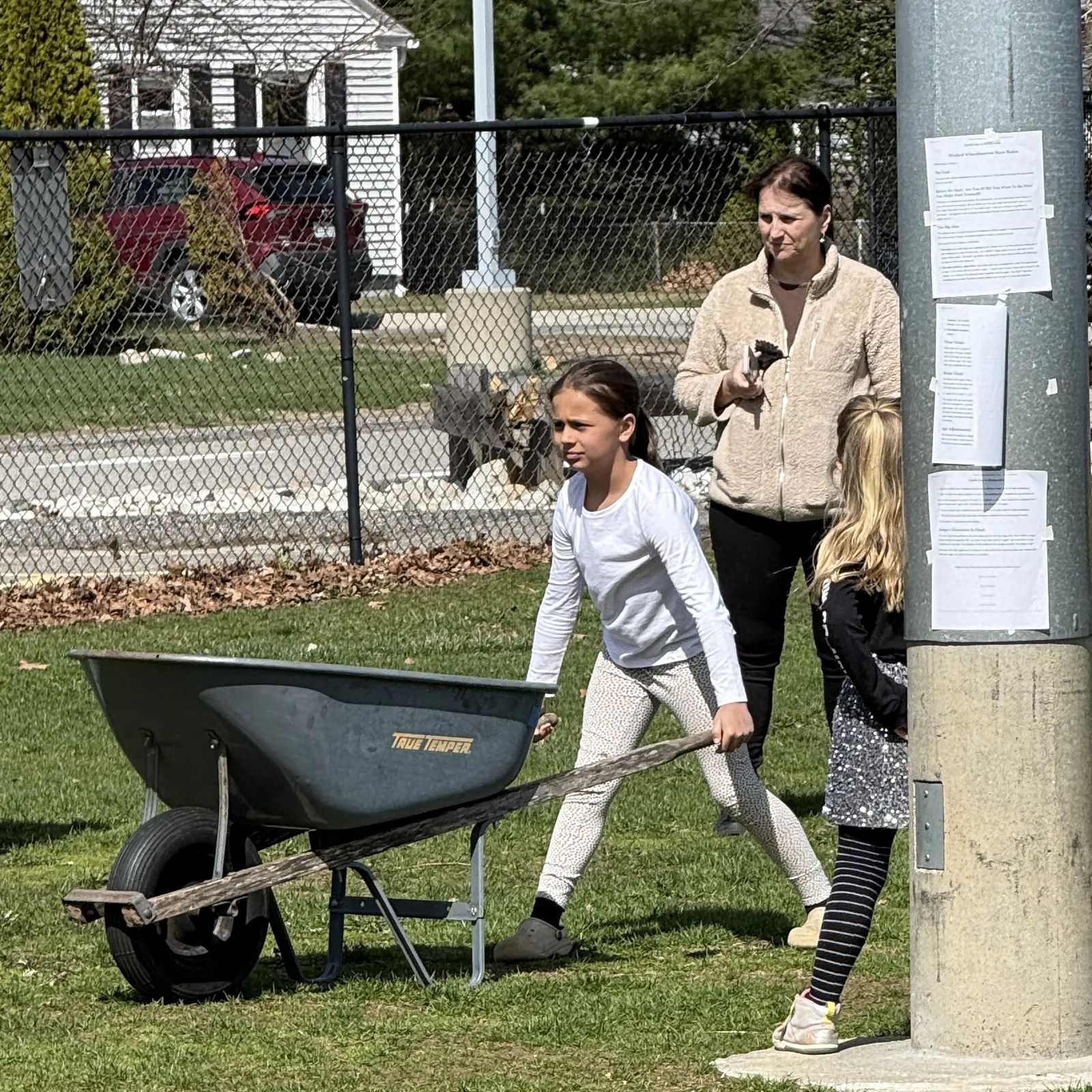 A child pushing a wheelbarrow during the Festival wheelbarrow race time trials